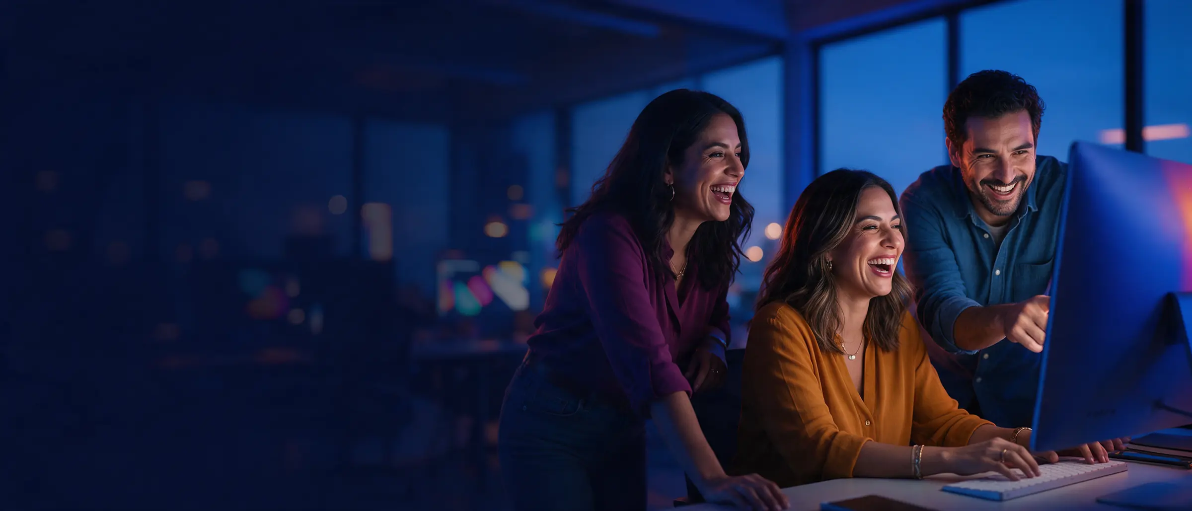 Tijuana digital marketing team reviewing a campaign on screen
